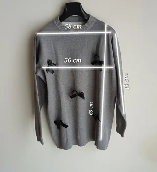 Maglia grigia con fiocchi neri