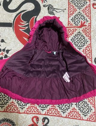 Piumino bambina fucsia con cappuccio