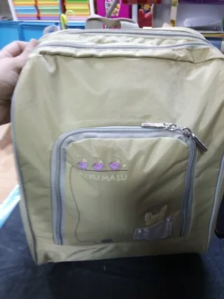 Mochila beige con estampado de animales