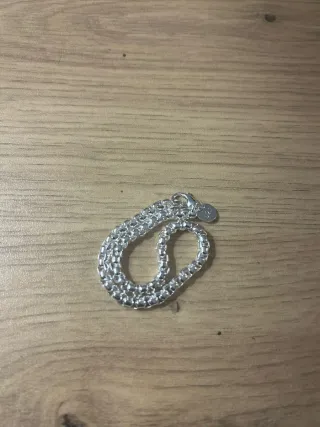 Cadena y pulsera impolutas