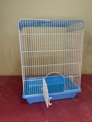 Jaula para pájaros azul y blanca