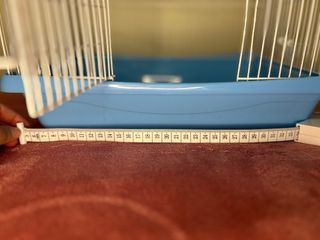 Jaula para pájaros azul y blanca