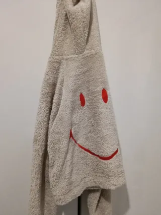 Chaqueta de peluche con cara sonriente
