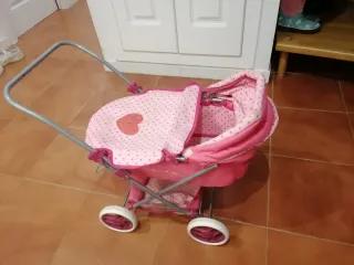 Passeggino rosa con pois per bambole