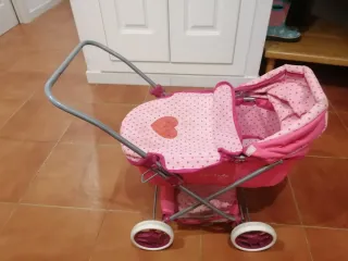 Passeggino rosa con pois per bambole