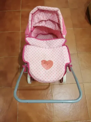 Passeggino rosa con pois per bambole