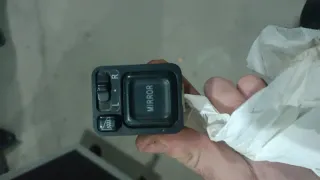 Botón espejo retrovisor eléctrico