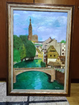 Cuadro al óleo de pueblo con puente