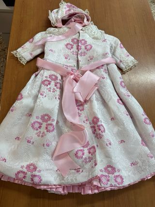 Volcada de bebé rosa con capota