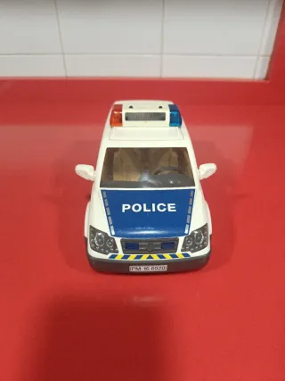 Coche de policía Playmobil con figura