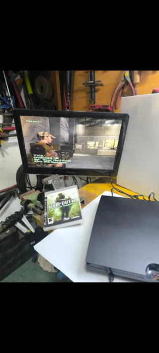 Console PlayStation 3 Nera + 4 Giochi