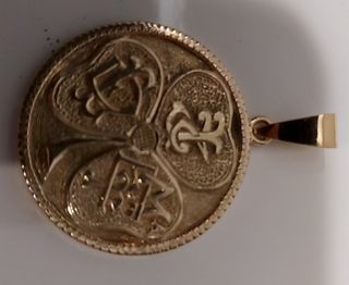 Colgante moneda oro 18k de 1930 y su peso 12,7gr