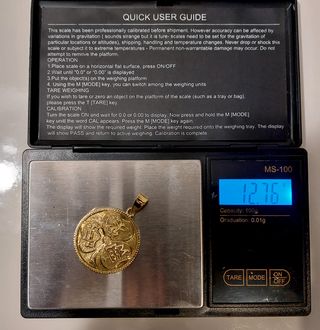Colgante moneda oro 18k de 1930 y su peso 12,7gr