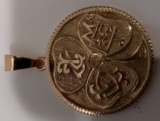 Colgante moneda oro 18k de 1930 y su peso 12,7gr