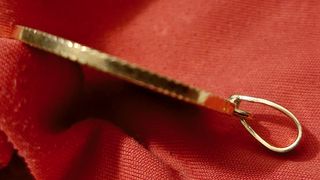 Colgante moneda oro 18k de 1930 y su peso 12,7gr