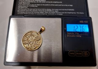 Colgante moneda oro 18k de 1930 y su peso 12,7gr