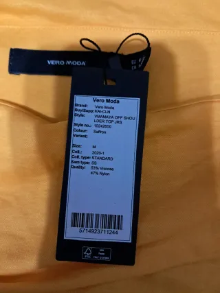 Blusa sin mangas con cuello drapeado