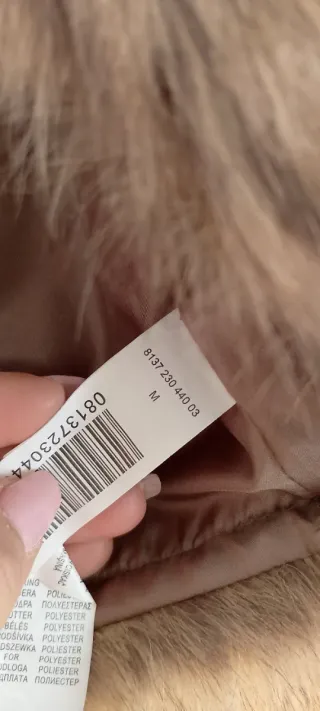 Chaleco de pelo marrón y gris