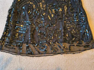 Vestido o blusa de lentejuelas negro