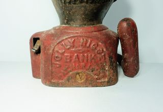Antigua hucha de hierro Jolly Nigger Bank.