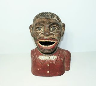 Antigua hucha de hierro Jolly Nigger Bank.