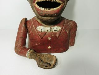 Antigua hucha de hierro Jolly Nigger Bank.