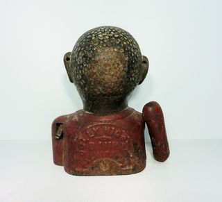 Antigua hucha de hierro Jolly Nigger Bank.