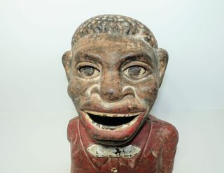 Antigua hucha de hierro Jolly Nigger Bank.
