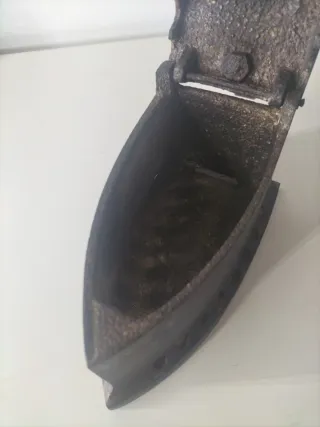 Plancha antigua de hierro fundido