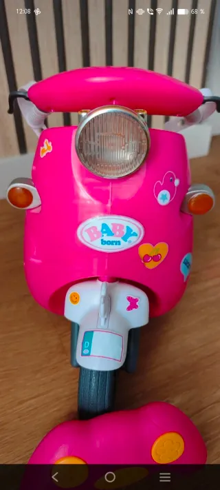 Moto rosa Baby Born con accesorios