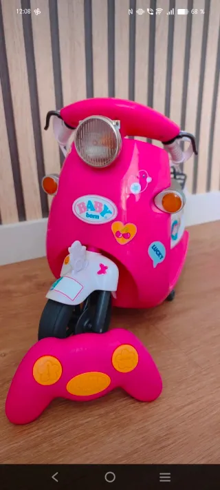 Moto rosa Baby Born con accesorios