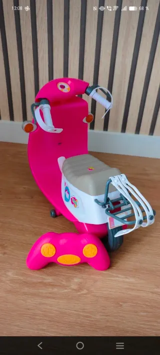 Moto rosa Baby Born con accesorios