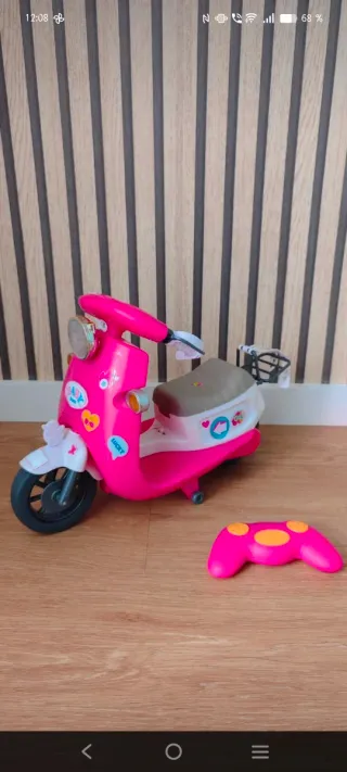 Moto rosa Baby Born con accesorios