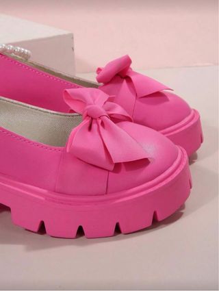 Zapatos de plataforma rosas con lazo. Nuevos.