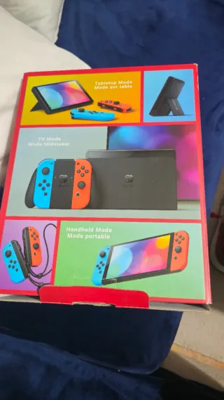 Nintendo Switch OLED Blu e Arancione