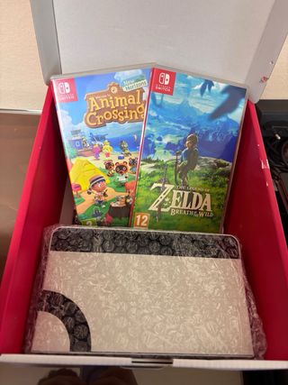 Nintendo Switch OLED bianca con giochi e accessori