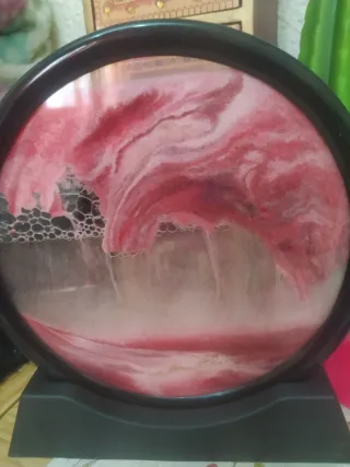 Decoración de arena rosa y roja