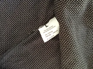 Minigonna nera con pois bianchi