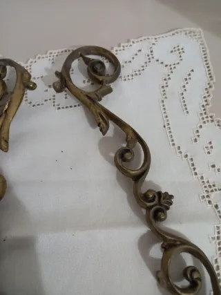 Coppia di fregi in ottone