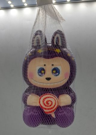 Juguete morado con estrellas y piruleta