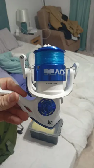 Caña de pescar y carrete como nuevos