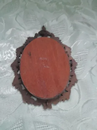 Cornice in ottone con decorazioni