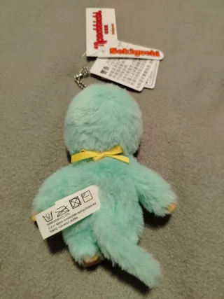 Monchichi verde con babero Colors