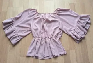 Blusa rosa con volantes