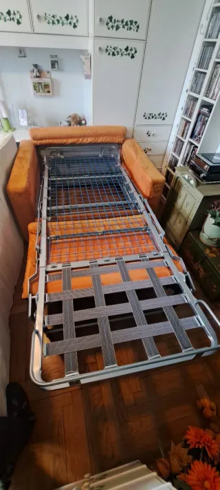 Poltrona letto arancione in tessuto