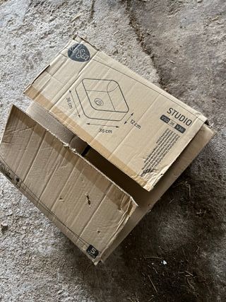 Lavabo sobre encimera de madera y cerámica