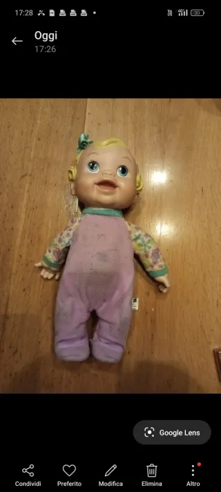 Bambola Baby Alive con fiocco