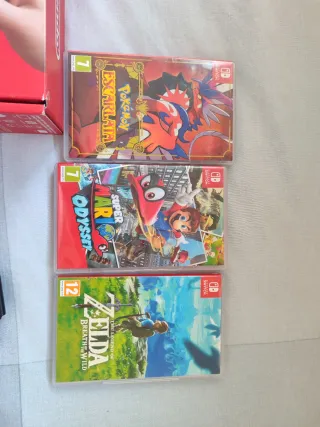 Nintendo Switch OLED + 3 giochi + custodia