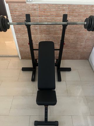 Press de banca con barra y discos