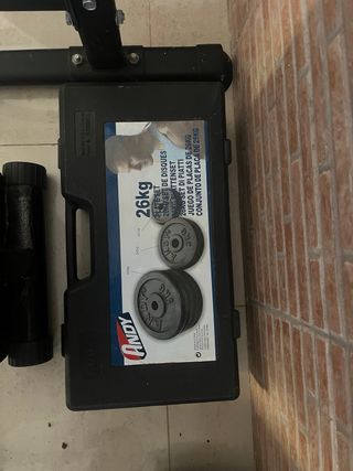 Press de banca con barra y discos